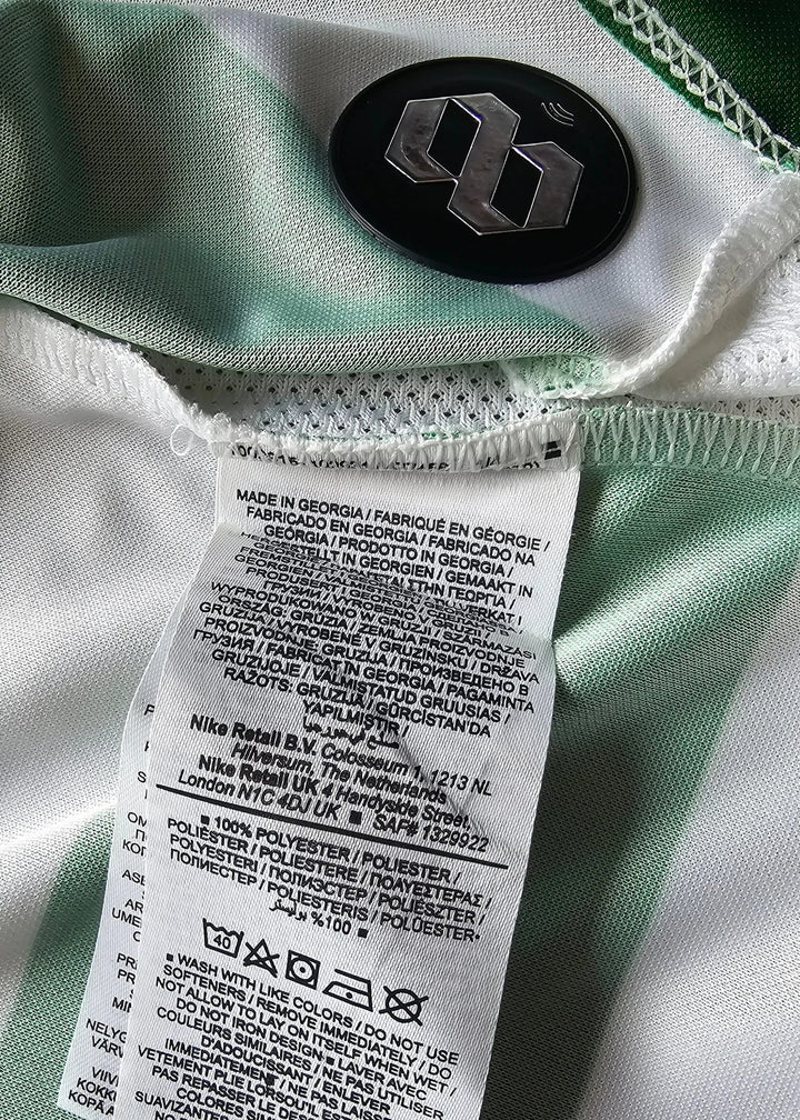 Care label detail reading Made in Georgia beside an NFC authentication tag on the shirt hem.