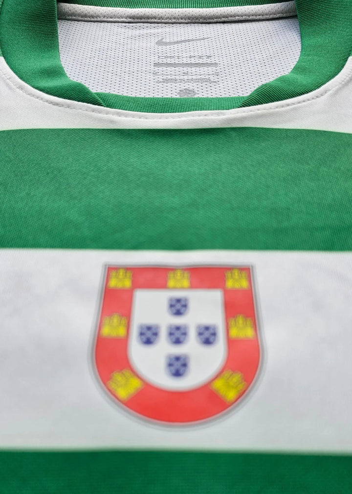 Nike neck tag stitched inside the collar of a green and white hooped shirt, with the chest crest visible out of focus below, Geovany Quenda's Sporting CP shirt.