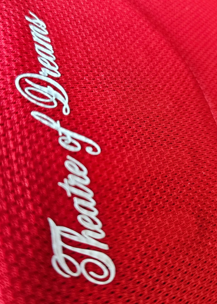 Interior collar tag reading Theatre of Dreams in white script, on the Jack Fletcher Manchester United F.C. 2025-2026 signed shirt.