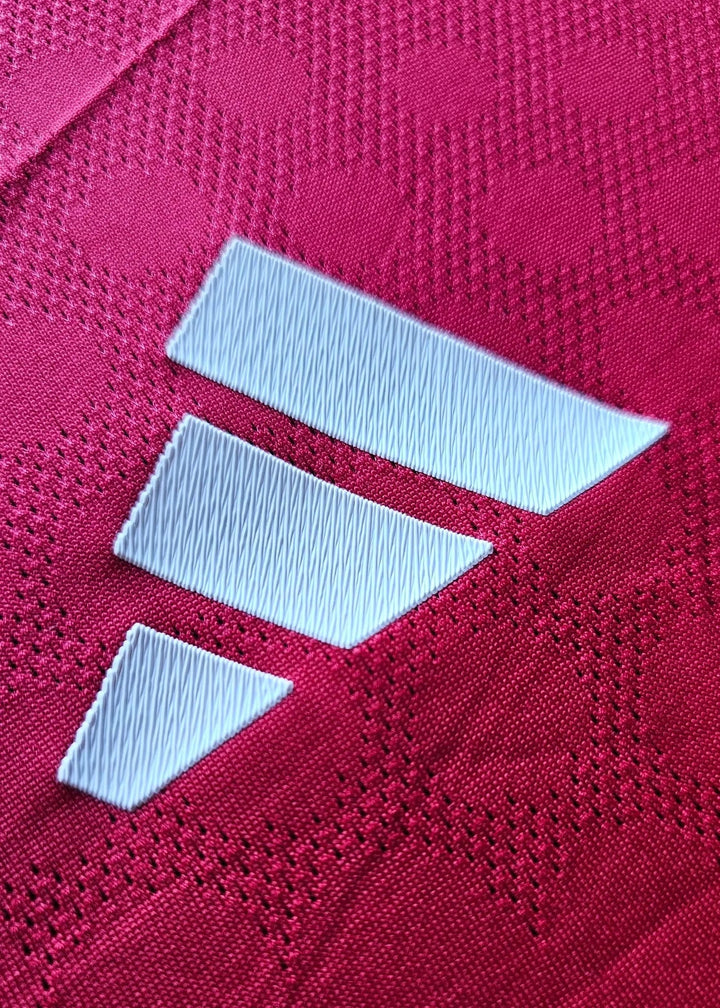 Close-up of the adidas three-stripe logo on the shoulder of the Jack Fletcher Manchester United F.C. 2025-2026 signed shirt.