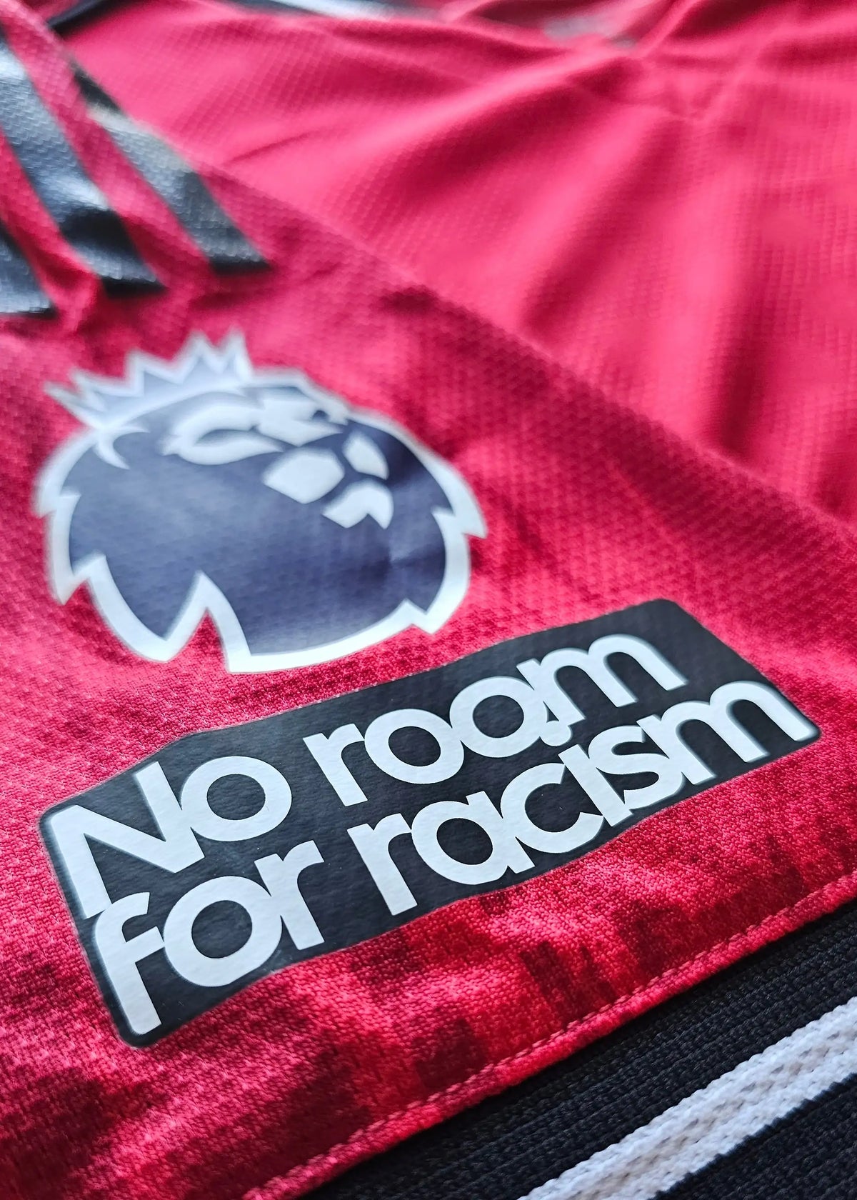 Premier League badge and No room for racism sleeve patch on the Jack Fletcher Manchester United F.C. 2025-2026 signed shirt.