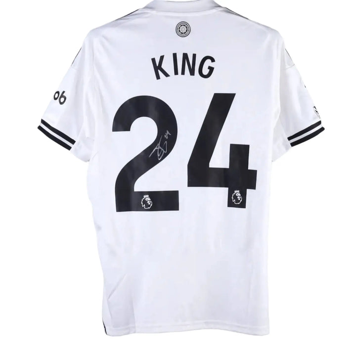 Back of a white Fulham F.C. shirt with a black KING nameset, number 24 and a grey-marker signature, Josh King's Fulham F.C. 2025-2026 No. 24 shirt.