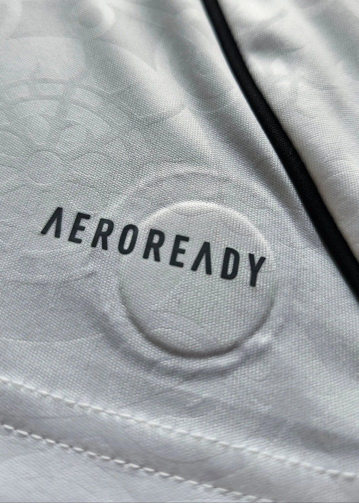 Close-up of the AEROREADY fabric print and black piping inside the collar, Josh King's Fulham F.C. 2025-2026 shirt.