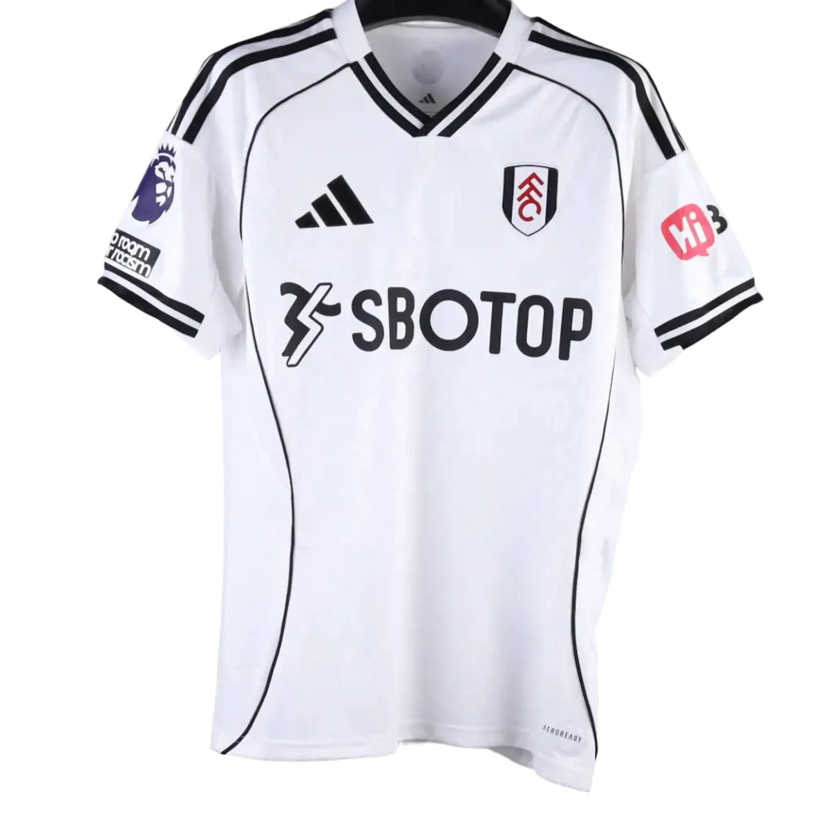 A white Fulham soccer jersey with black stripes and logos, hanging on a black hanger against a gray background. The jersey features the Adidas logo, Sbotop sponsor logo, Premier League patch, and MWS on the hanger.