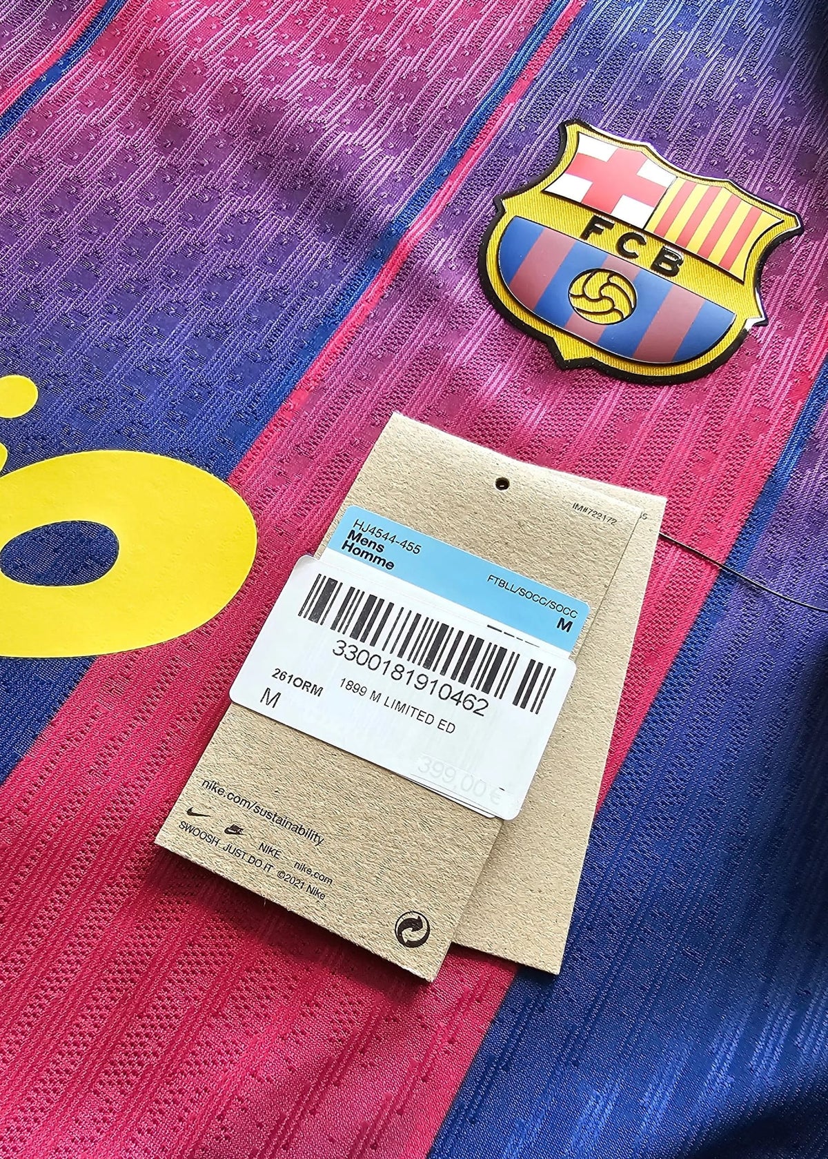 Nike hang tag reading 1899 M Limited Ed beside the FCB crest on the collaboration shirt.