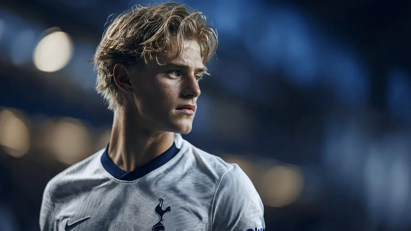 Lucas Bergvall in Tottenham Hotspur kit sprinting forward, orange and teal motion blur behind him.
