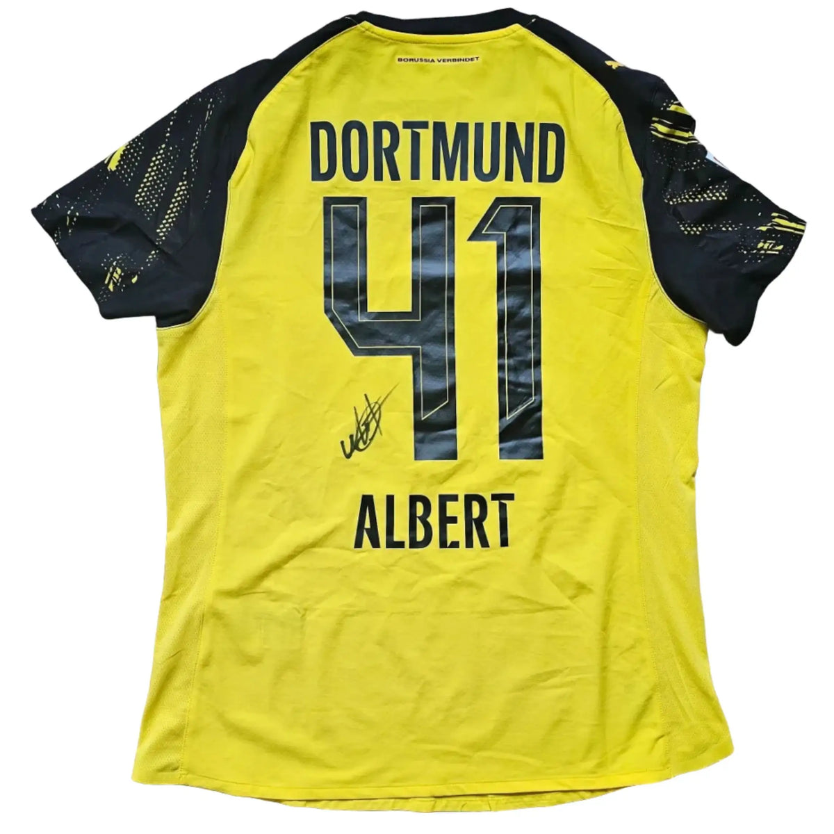 Back view showing number 41, name Albert, and a visible signature on a yellow Borussia Dortmund football shirt.
