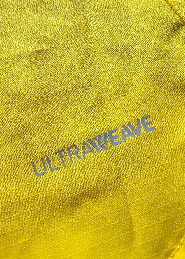A macro shot of the yellow ripstop fabric shows the grey ULTRAWEAVE performance-fabric branding near a seam line.