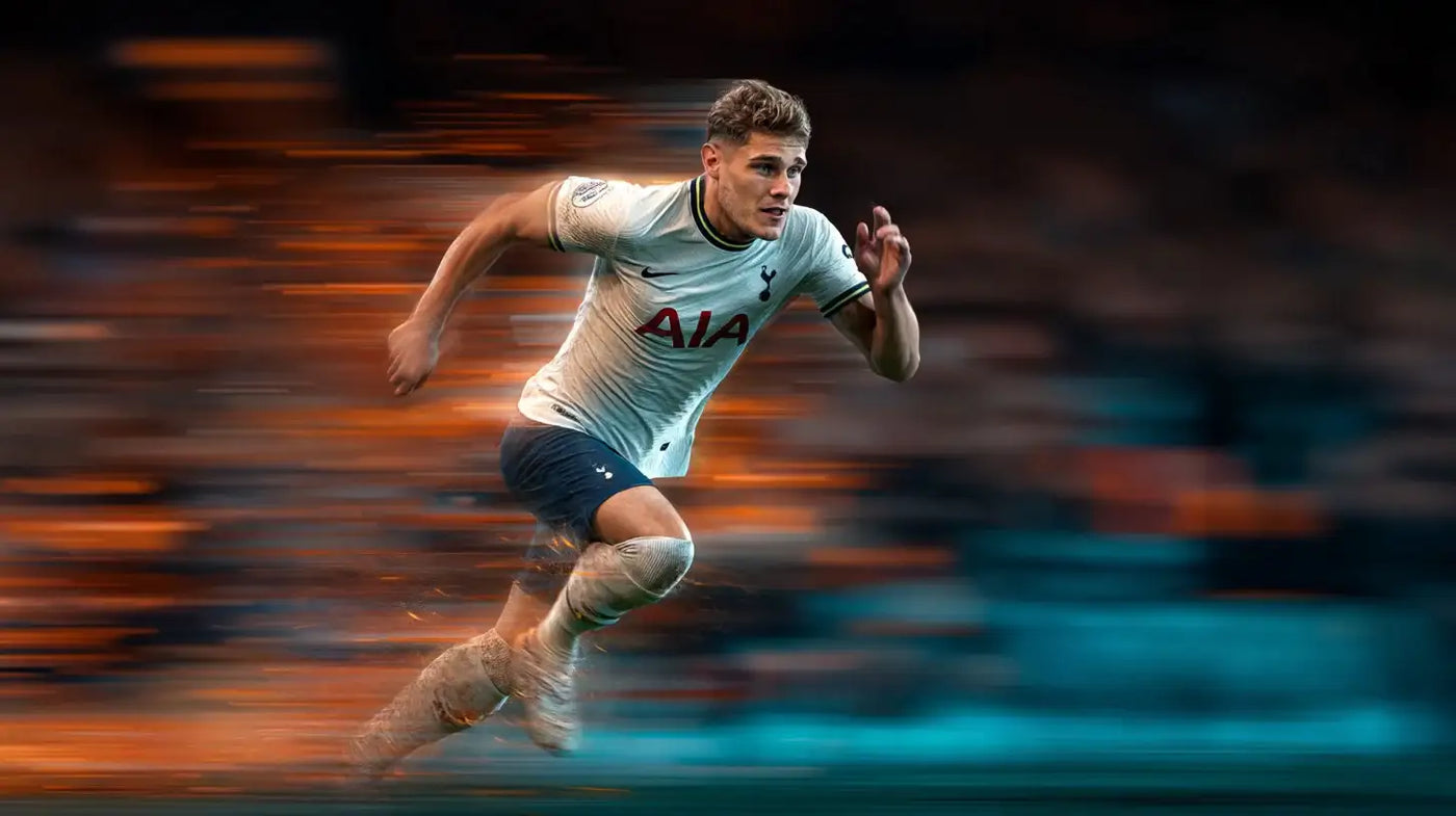 Micky van de Ven in Tottenham Hotspur away kit sprinting, orange and teal motion blur suggesting top speed.