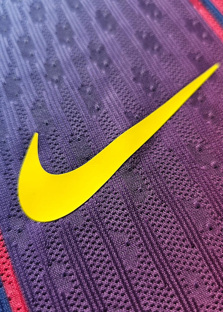 Yellow Nike swoosh printed on the purple-to-pink gradient fabric of Pau Cubarsí's FC Barcelona 2025-2026 football shirt, No. 5.