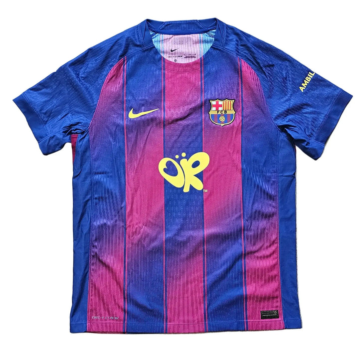 Front view of the Pau Cubarsi Barcelona Olivia Rodrigo shirt with the Nike swoosh and FCB crest.