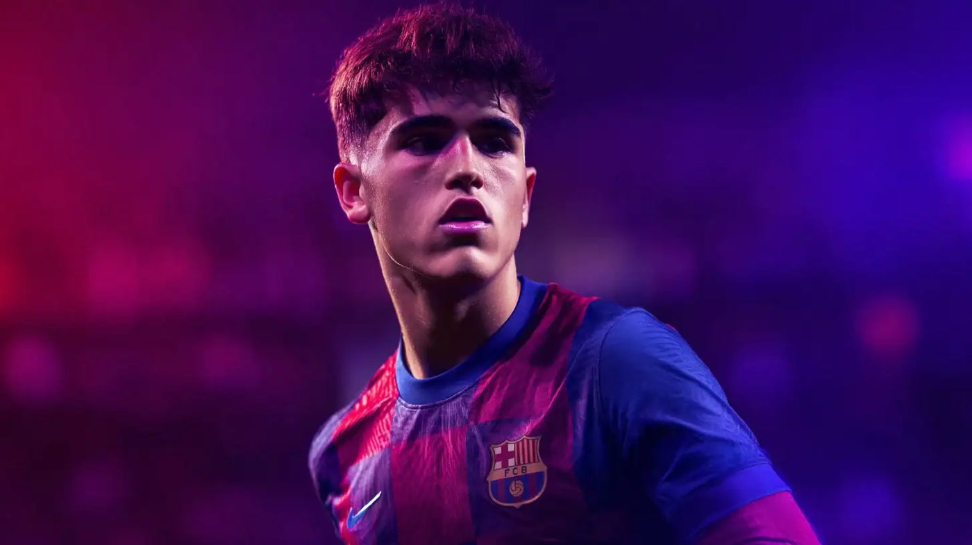 Pau Cubarsí in FC Barcelona home shirt under purple stadium lighting, eyes fixed on the play.