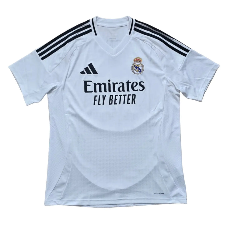 Real Madrid 2024-25 home shirt front in white, with adidas striped shoulders, the Emirates Fly Better sponsor and the club crest.