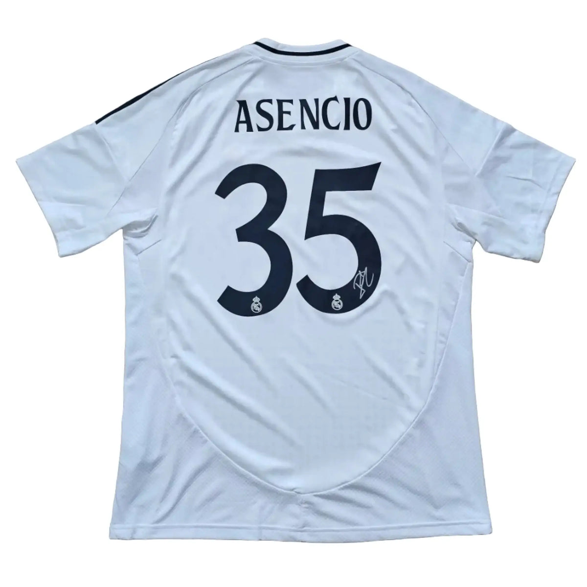 Back view showing Asencio, No. 35, and a visible signature on a white football shirt.