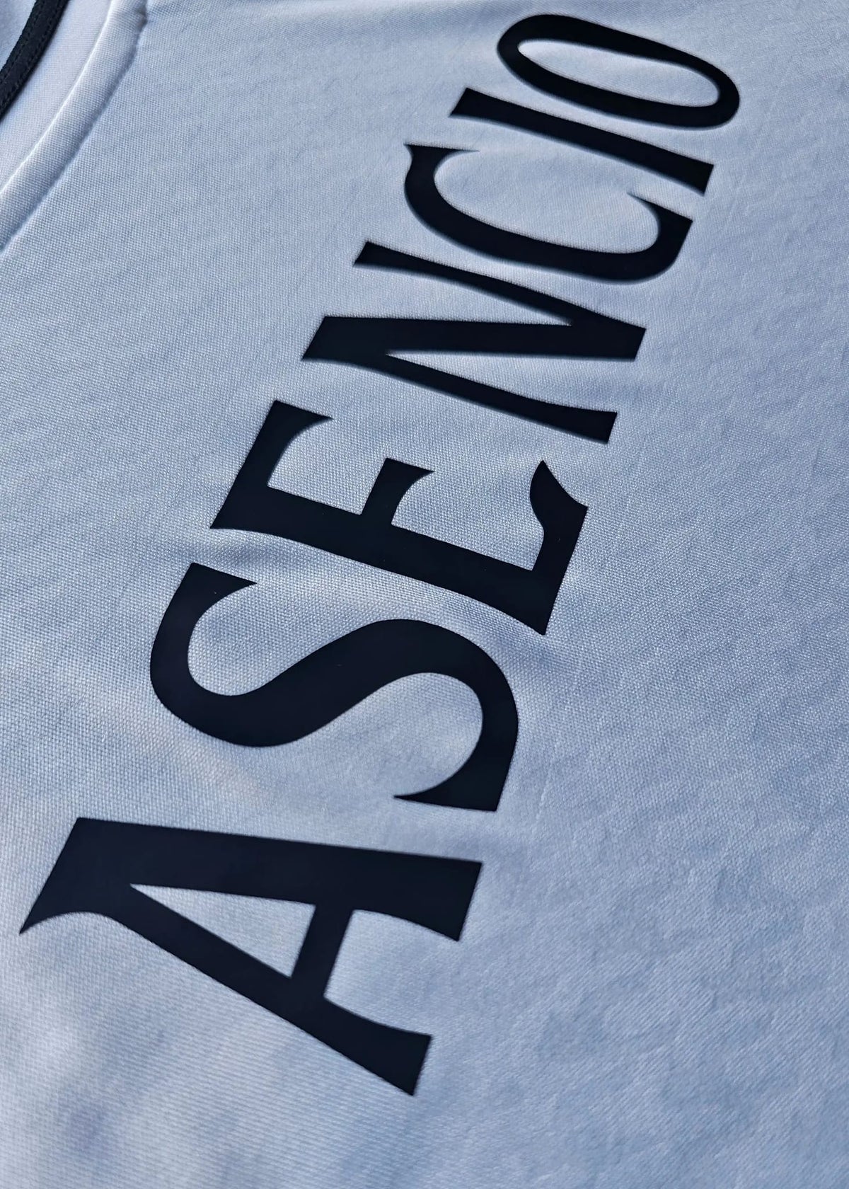 The ASENCIO nameplate is printed in black across the back of this Raul Asencio Real Madrid 2024-2025 No. 35 shirt, shown in close-up.
