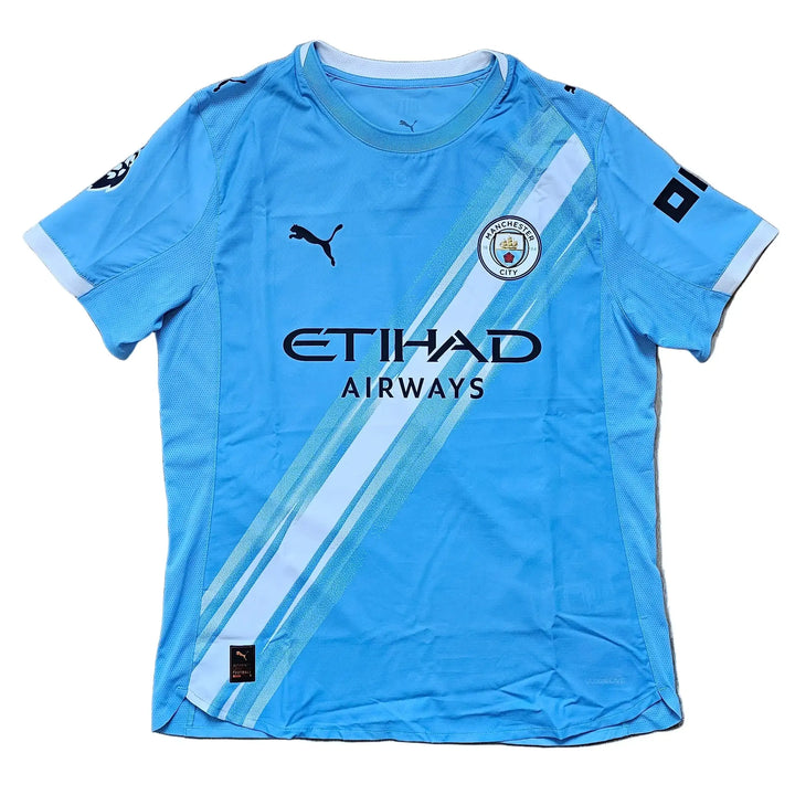 Front of a sky-blue Manchester City home shirt with the Etihad Airways sponsor and a Puma logo, from the signed Reigan Heskey Man City shirt.