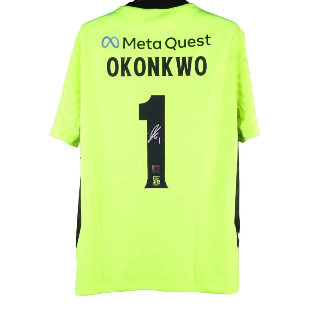 Back view showing No. 1, name Okonkwo, and signature detail on a neon green football shirt.