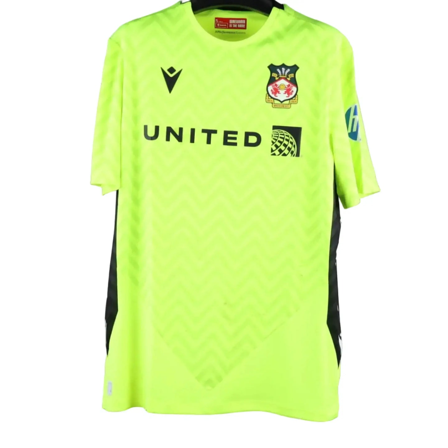 Front view showing Wrexham A.F.C. crest, 'UNITED' wordmark, and vibrant yellow-green color.