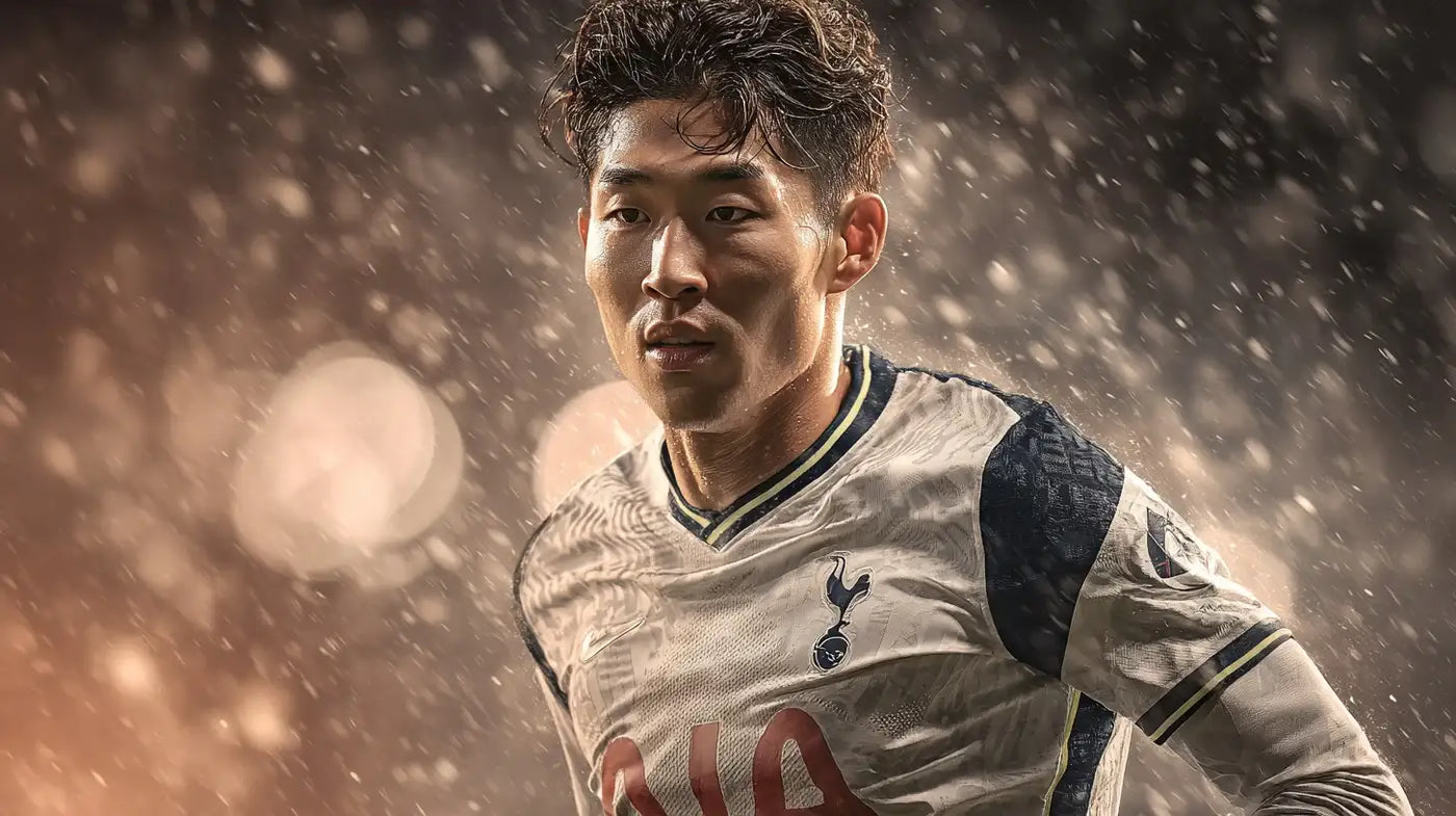 Son Heung-min in a white Tottenham Hotspur football shirt with dark navy sleeves, running through heavy rain with blurred stadium lights in the background.
