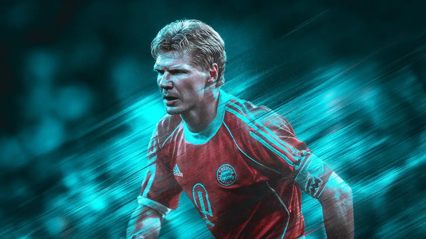Stefan Effenberg in red Bayern Munich football shirt with white stripes, running forward with an intense expression.