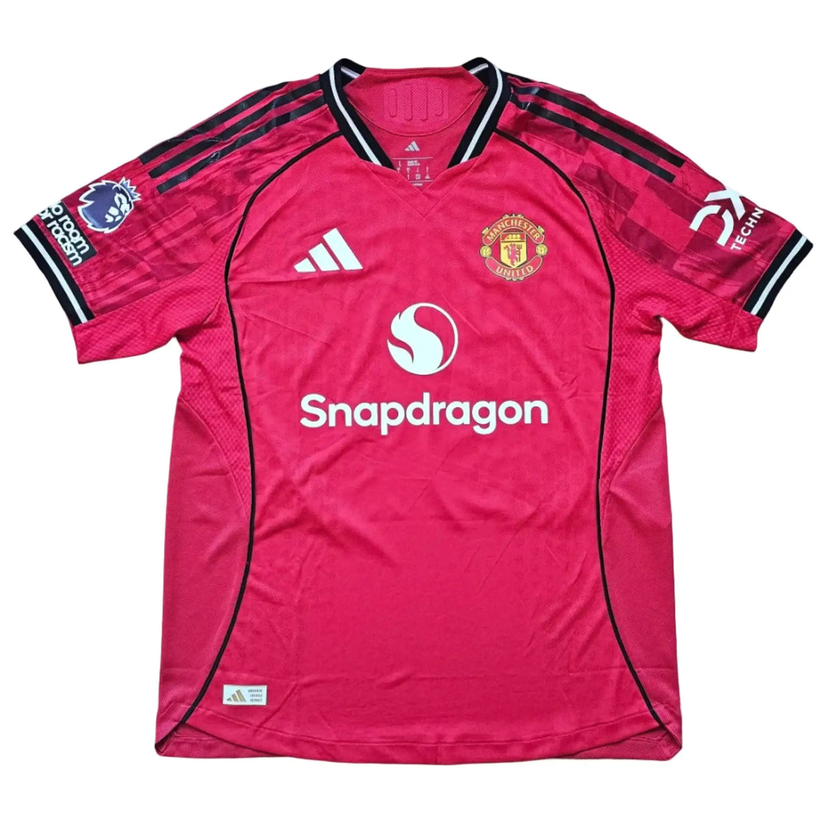 Front of the red shirt with Manchester United crest, adidas logo, and Snapdragon sponsor, from Tyler Fletcher's Manchester United F.C. Signed shirt.