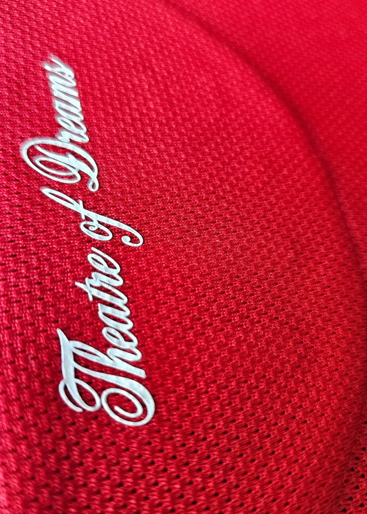 Interior collar tag reading Theatre of Dreams in white script, on Tyler Fletcher's Manchester United F.C. Signed shirt.