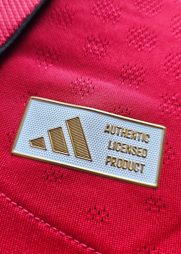 Adidas tag reading Authentic Licensed Product in gold, sewn inside Tyler Fletcher's Manchester United F.C. Signed shirt.