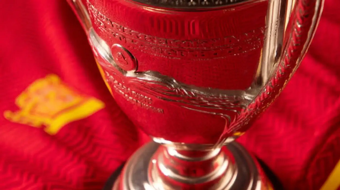 Henri Delaunay trophy for UEFA European Championship 2024, close framed silver cup in front of a bold red background with yellow accents representing Spain.