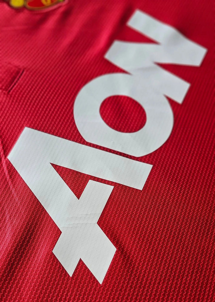 Aon sponsor lettering printed in white on the red chest, from Robin van Persie's signed Manchester United 2014-15 No. 20 shirt.