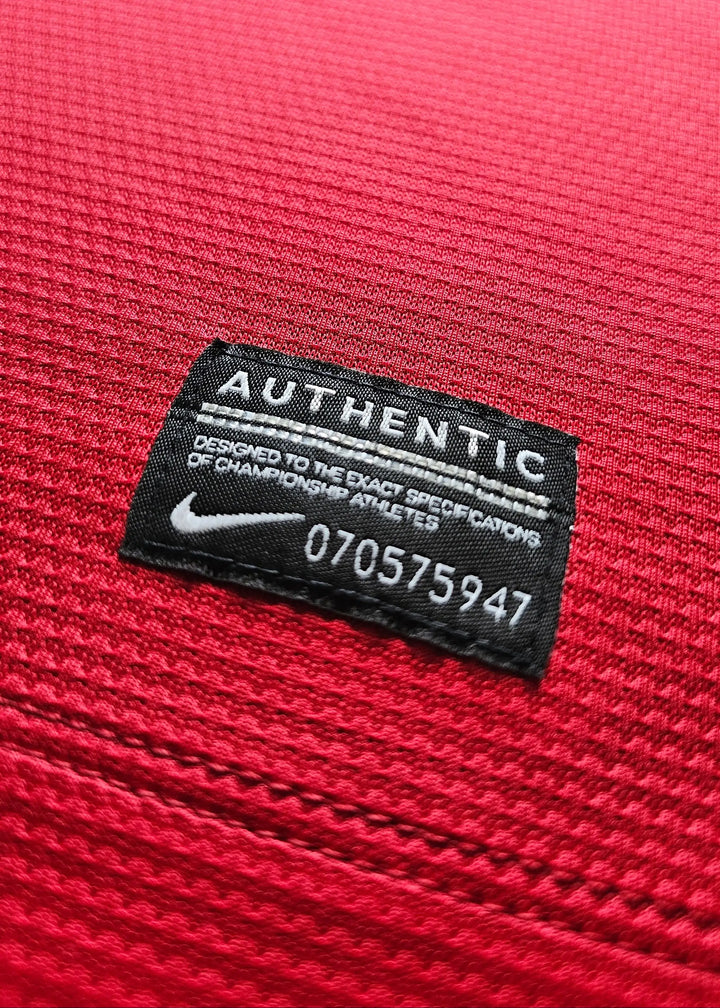 Nike Authentic tag at the hem with serial 070575947, on Robin van Persie's signed Manchester United 2014-15 No. 20 shirt.