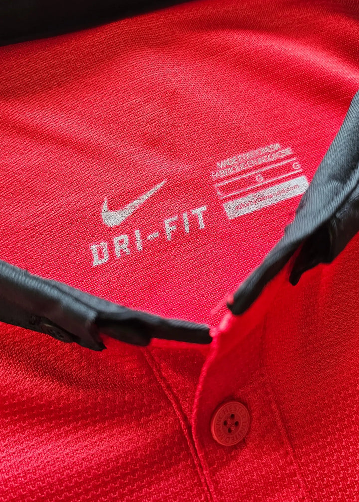 Inside collar tag reading Nike DRI-FIT, size L and Made in Indonesia, on Robin van Persie's signed Manchester United 2014-15 No. 20 shirt.