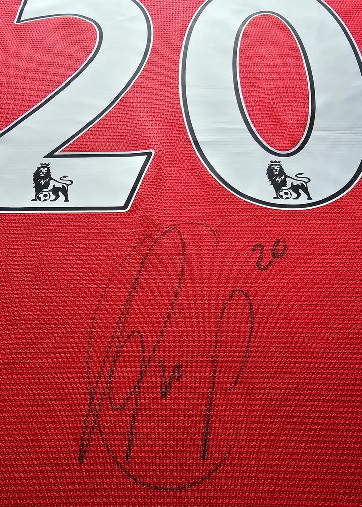 Close-up of the white No. 20 with a black-ink signature beneath it, on Robin van Persie's signed Manchester United 2014-15 shirt back.