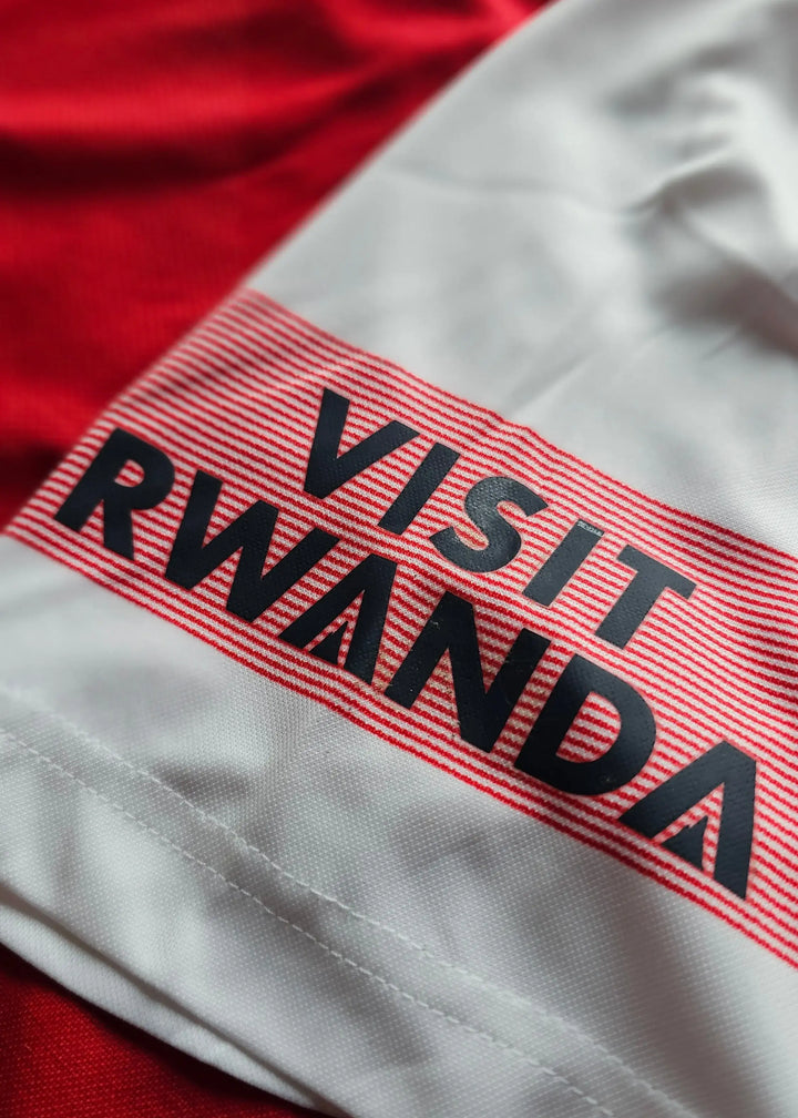 Close-up of the 'Visit Rwanda' sponsor print on the white shirt sleeve, from Vivianne Miedema's 2018-2019 Arsenal shirt.