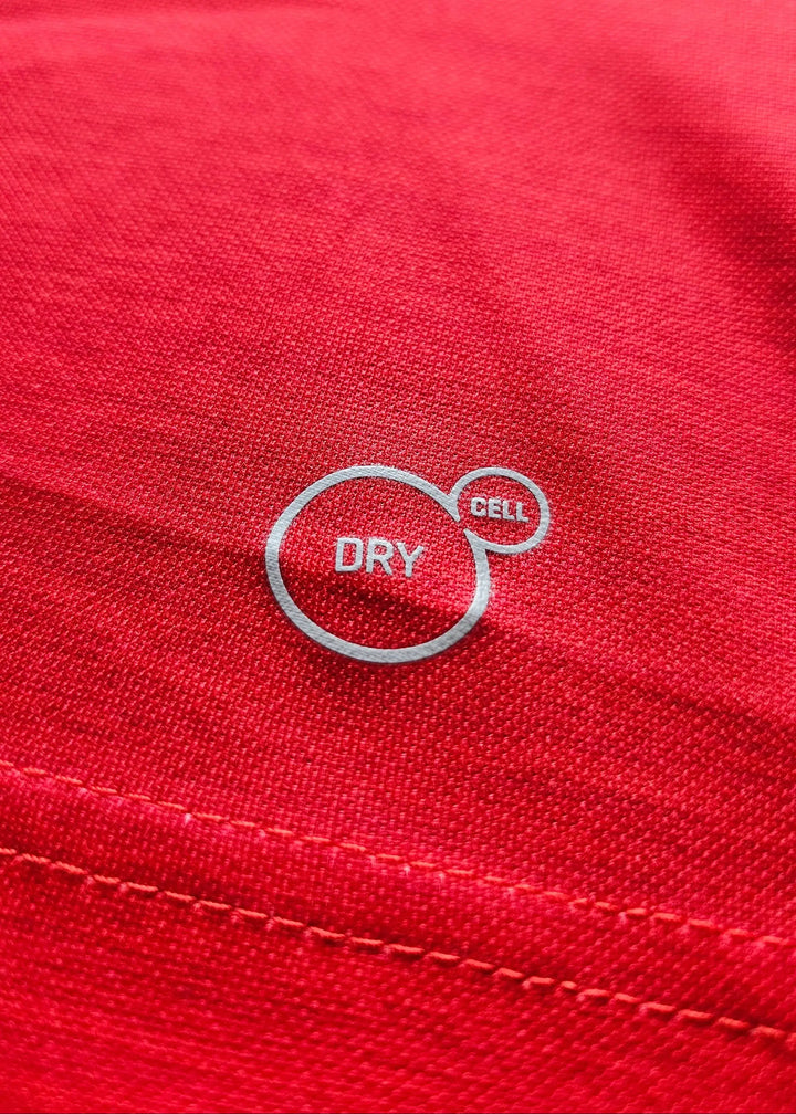 Close-up of the white 'Dry Cell' performance fabric print on the shirt's red body, from Vivianne Miedema's 2018-2019 Arsenal shirt.
